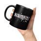 SNAFU_11oz_Black_Mug_11oz_Black_LH_Model_Mockup.png_16083395